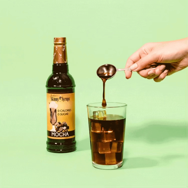 Sugar Free Mocha Syrup being placed into a glass